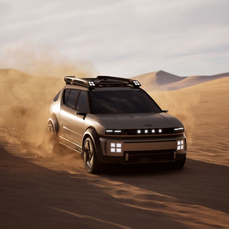 When Is The Ex90 Coming Out? A futuristic SUV driving through desert sand, showcasing off-road capability.
