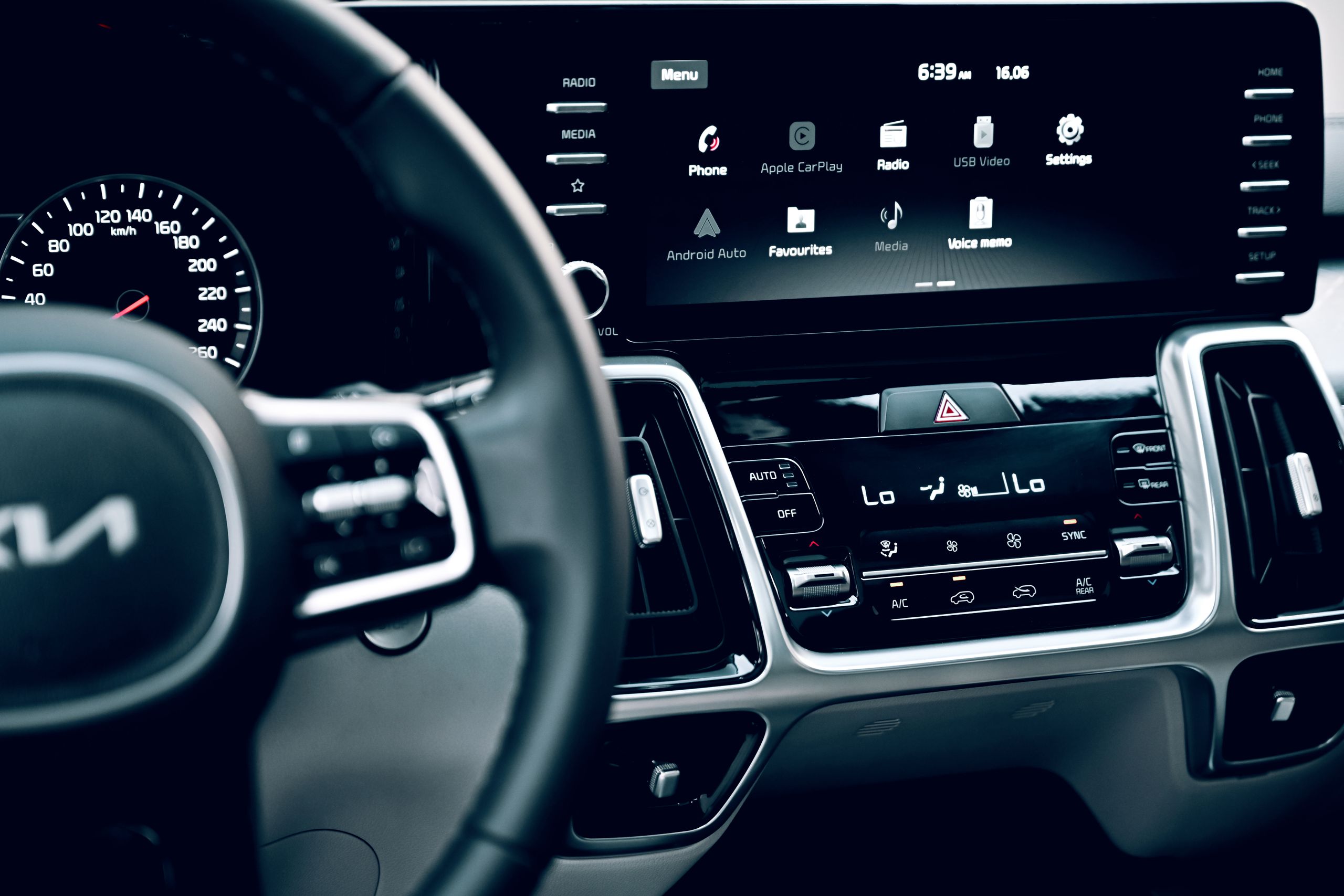 Does Volvo EX30 Have Apple CarPlay? Close-up view of a luxury car's dashboard featuring a modern touchscreen display and advanced features.