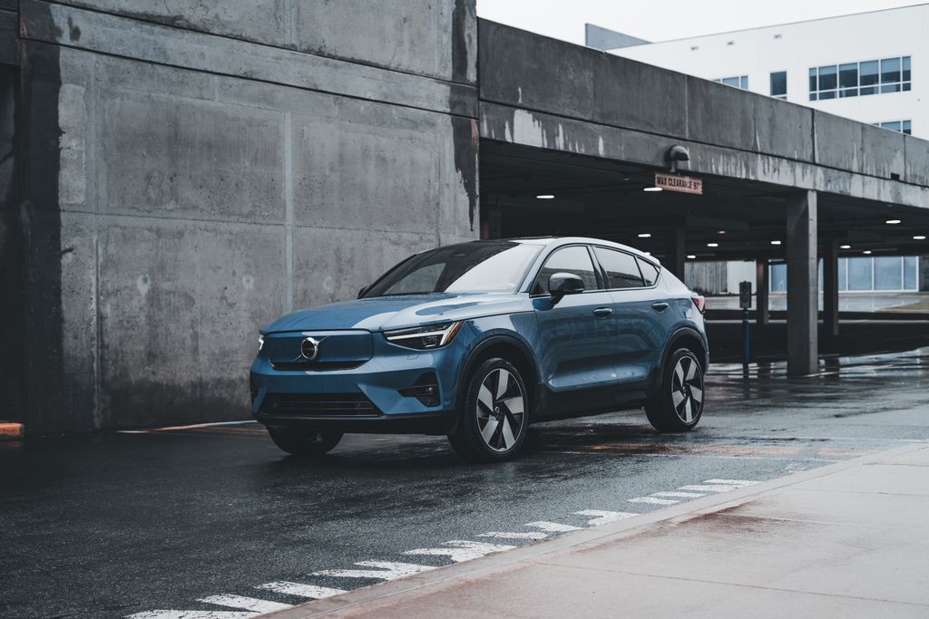 When Was the 2025 Volvo XC60 Available? Blue Volvo SUV parked in a modern urban environment showcasing sleek design and urban lifestyle.