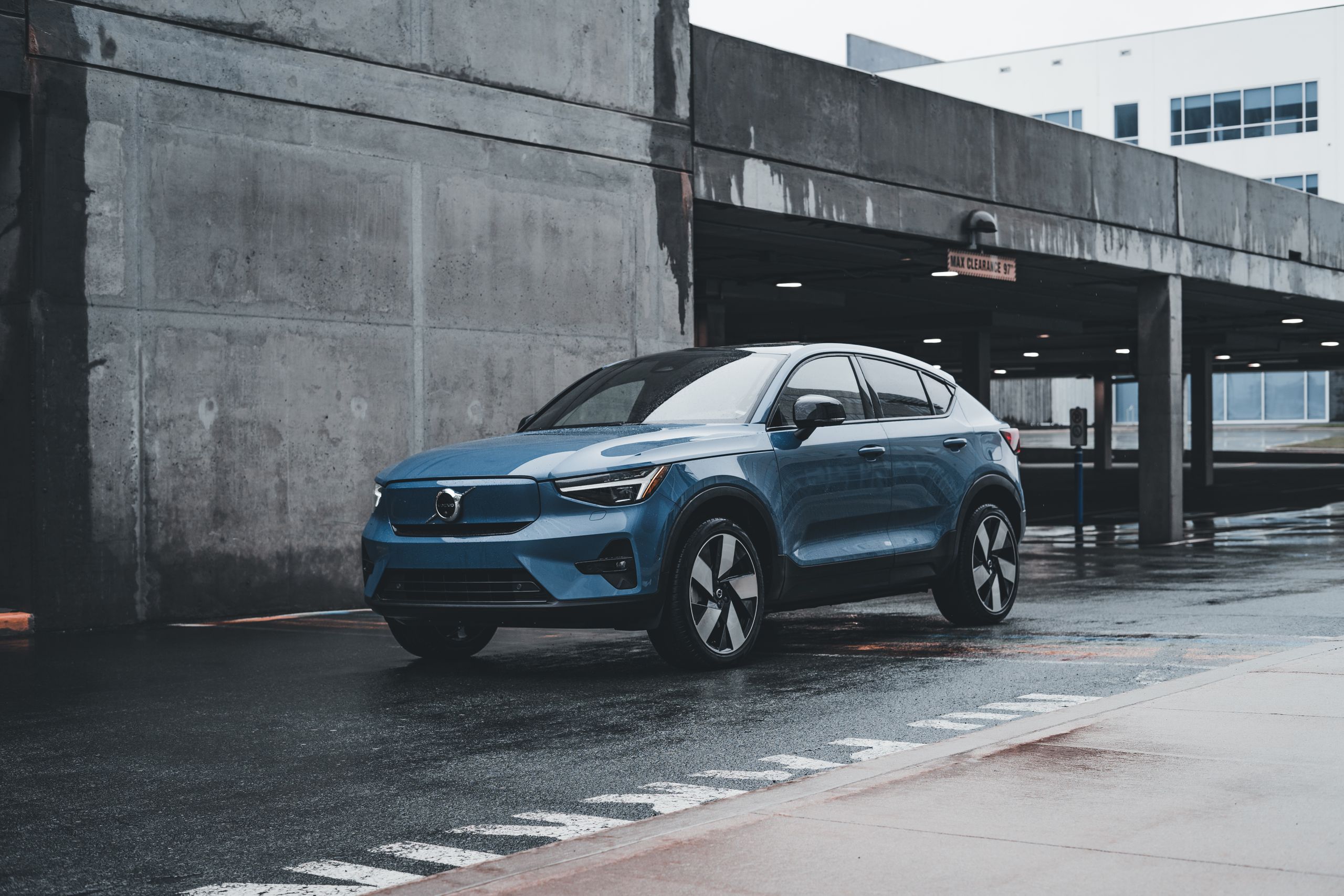 When Was the 2025 Volvo XC60 Available? Blue Volvo SUV parked in a modern urban environment showcasing sleek design and urban lifestyle.